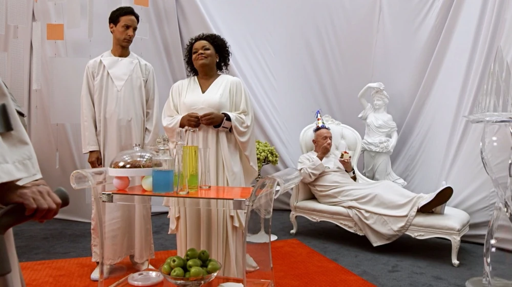Still from the Community episode App Development and Condiments showing the 5s lounging in white robes
