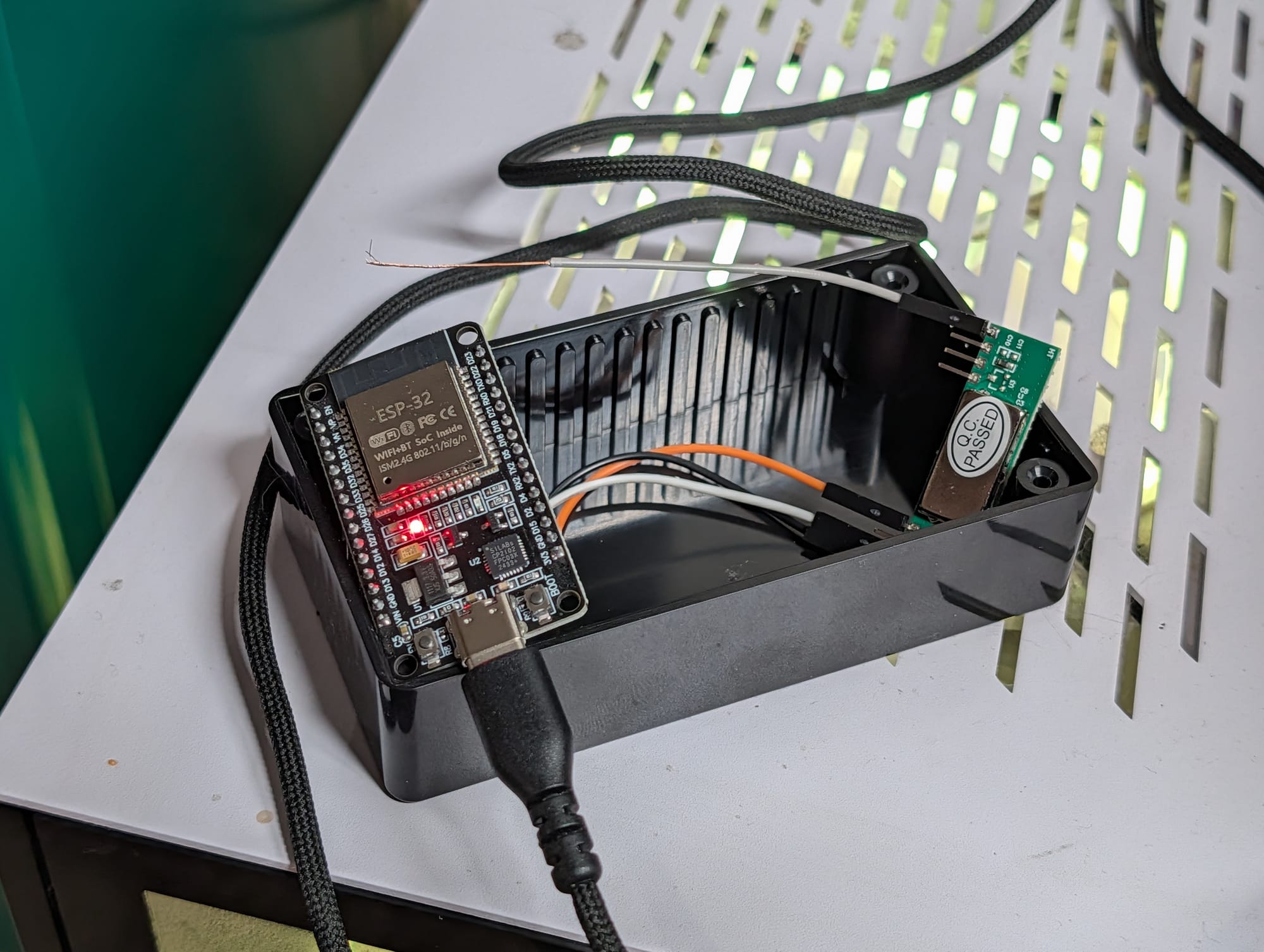 The finished bridge wired up and powered on, an ESP32 with its status LED lit next to the RXB6 receiver module